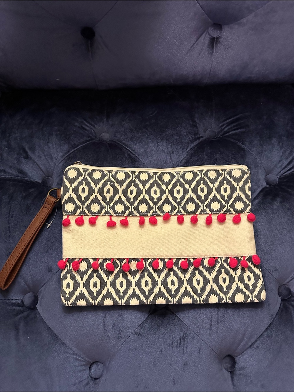 Boho Pom-Pom Wristlet Clutch in Black and Cream